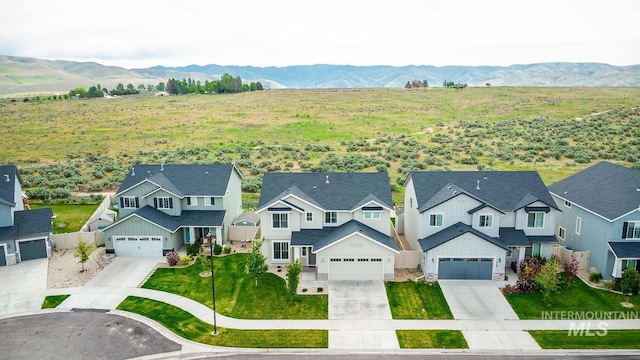 8228 S Bogus Ridge Ave, Boise, ID 83716 - aerial view of residential area featuring a mountain backdrop