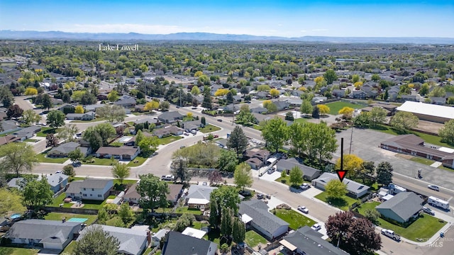 aerial perspective of suburban area featuring a mountainous background