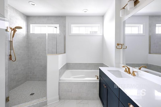 7927 W Rockhaven Dr, Eagle, ID 83616 - full bath with vanity, a garden tub, a shower stall, and marble look tile flooring
