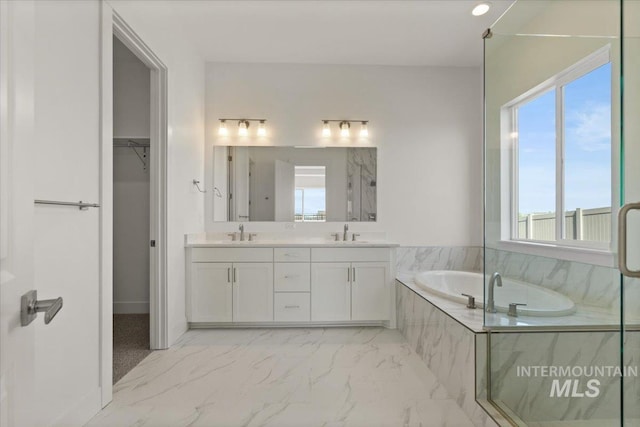 2158 N Kenora Ave, Star, ID 83669 - full bath featuring marble finish flooring, a bath, double vanity, a marble finish shower, and a walk in closet