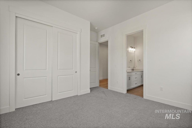 2158 N Kenora Ave, Star, ID 83669 - unfurnished bedroom with dark colored carpet, a closet, and ensuite bathroom