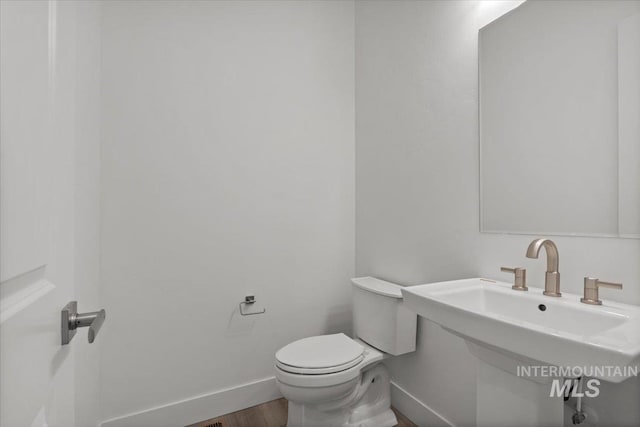2158 N Kenora Ave, Star, ID 83669 - half bathroom featuring baseboards and wood finished floors