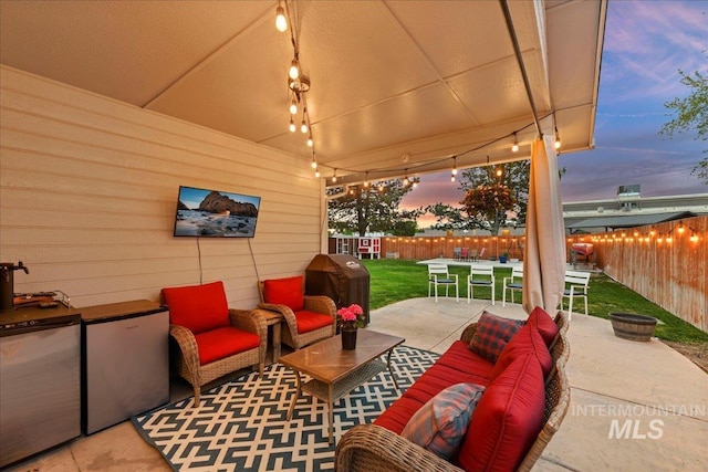 view of patio / terrace featuring area for grilling, an outdoor living space, a fenced backyard, and outdoor dining space