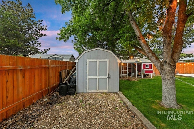 view of shed with a fenced backyard