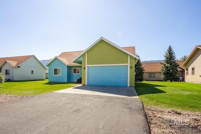 view of front of house featuring a front lawn and a garage