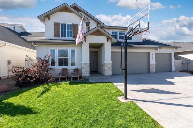 view of front of house featuring a garage and a front lawn