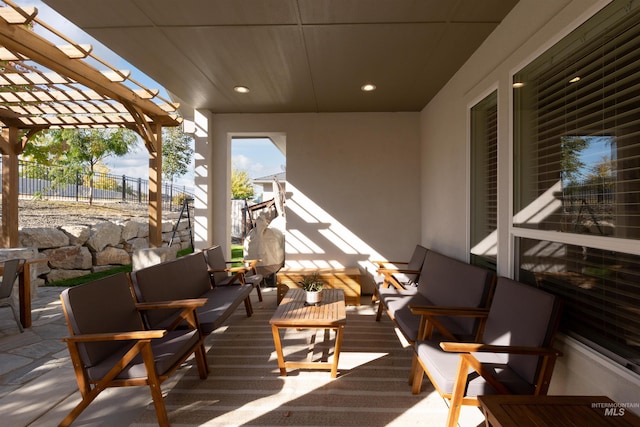 exterior space featuring outdoor lounge area and a pergola