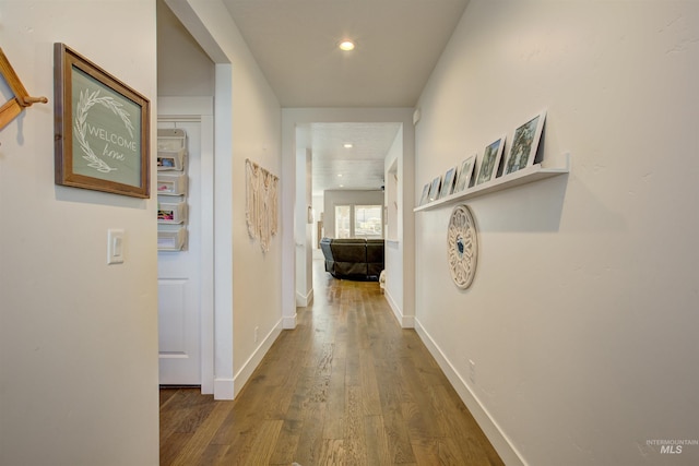 corridor featuring dark wood-type flooring