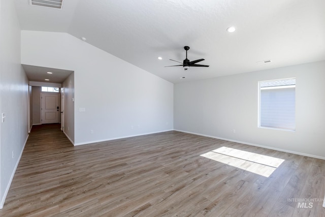 unfurnished living room featuring light wood-style floors, visible vents, and a ceiling fan