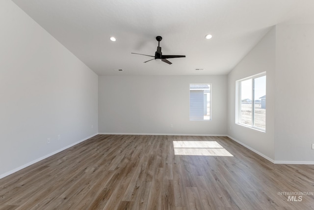 spare room with ceiling fan, recessed lighting, baseboards, and wood finished floors