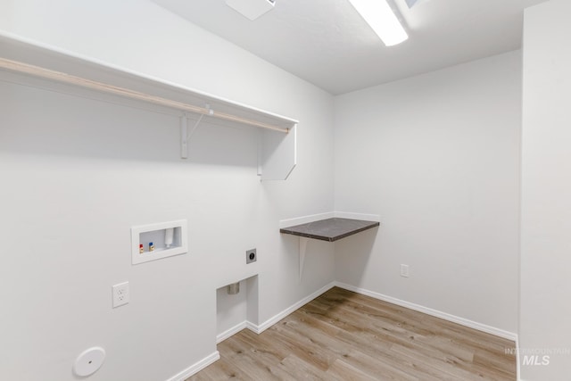 washroom featuring wood finished floors, laundry area, hookup for an electric dryer, washer hookup, and baseboards