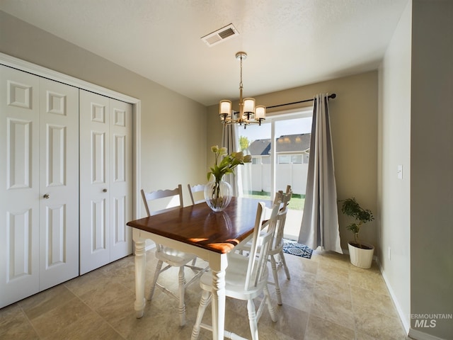 5122 Allentown St, Caldwell, ID 83605 - dining room featuring a chandelier and baseboards