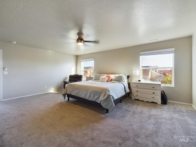 5122 Allentown St, Caldwell, ID 83605 - carpeted bedroom featuring baseboards, a textured ceiling, and a ceiling fan