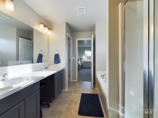 5122 Allentown St, Caldwell, ID 83605 - ensuite bathroom with double vanity, a garden tub, a shower with door, and baseboards
