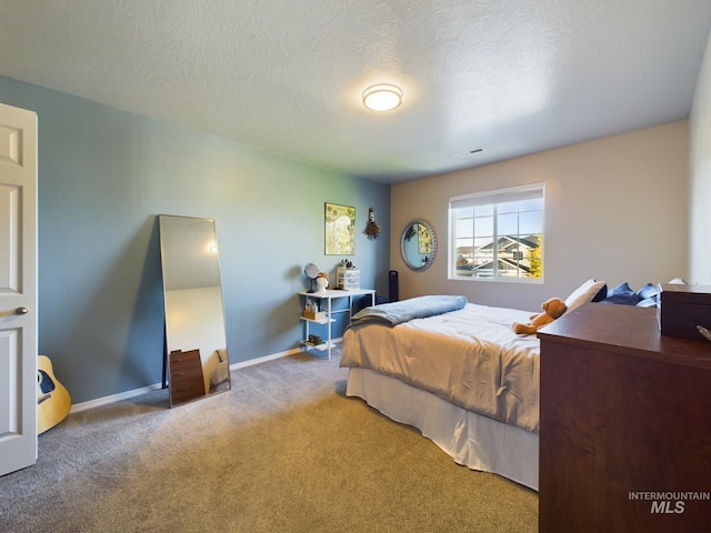 5122 Allentown St, Caldwell, ID 83605 - bedroom with carpet floors, baseboards, and a textured ceiling