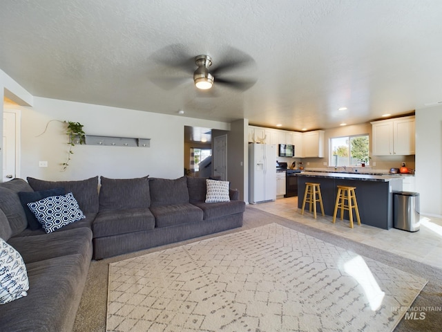 5122 Allentown St, Caldwell, ID 83605 - living area featuring a ceiling fan, recessed lighting, and light colored carpet