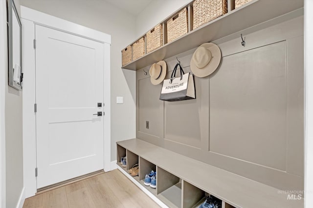 mudroom with light wood-style flooring