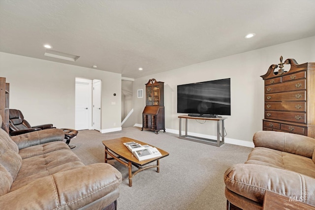 living area with attic access, carpet floors, baseboards, and recessed lighting