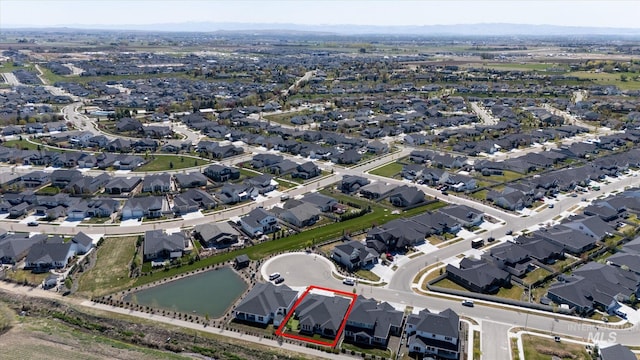bird's eye view featuring a residential view and a water view