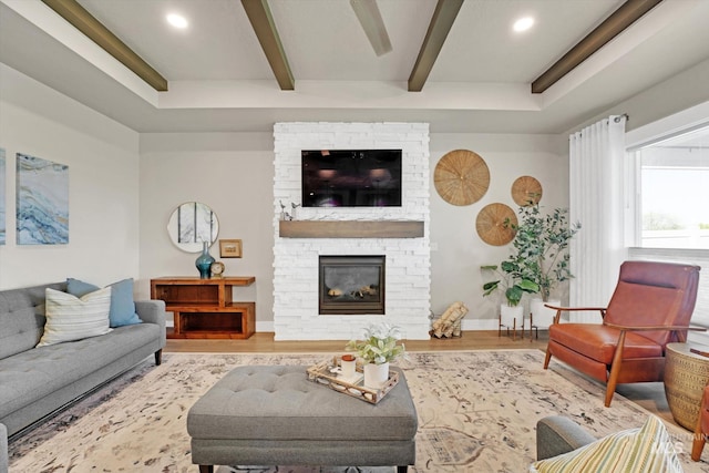 living area featuring a fireplace, wood finished floors, beam ceiling, and recessed lighting