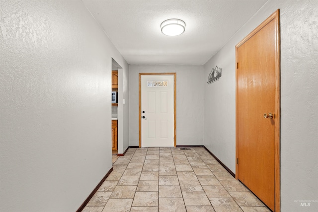 interior space featuring a textured ceiling