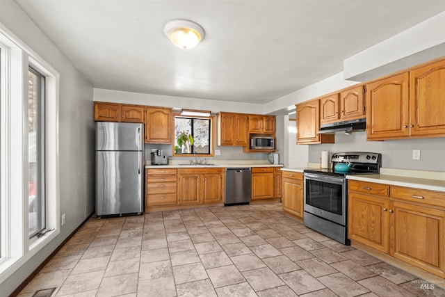 kitchen with appliances with stainless steel finishes and sink