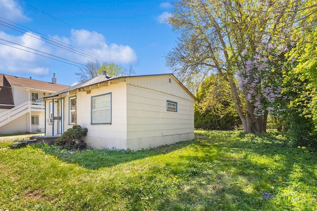 view of home's exterior featuring a lawn