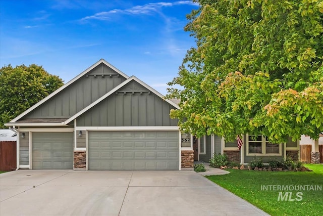 562 Castle Rock Ave, Middleton, ID 83644 - craftsman-style house featuring board and batten siding, a garage, driveway, and stone siding