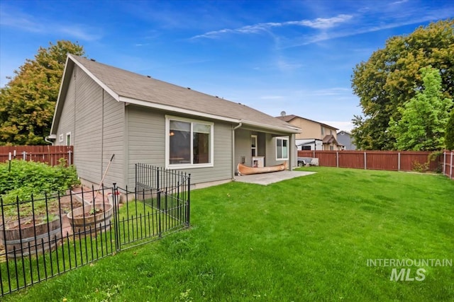 562 Castle Rock Ave, Middleton, ID 83644 - rear view of property with a patio area and a vegetable garden