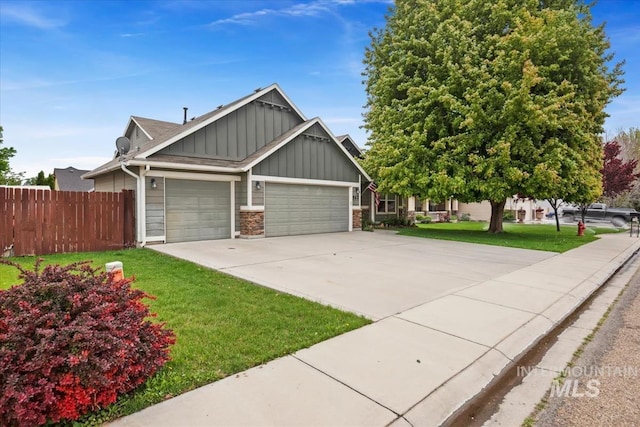 562 Castle Rock Ave, Middleton, ID 83644 - view of front of home with board and batten siding, a garage, and concrete driveway
