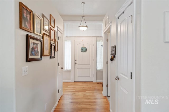 562 Castle Rock Ave, Middleton, ID 83644 - corridor featuring light wood finished floors and baseboards