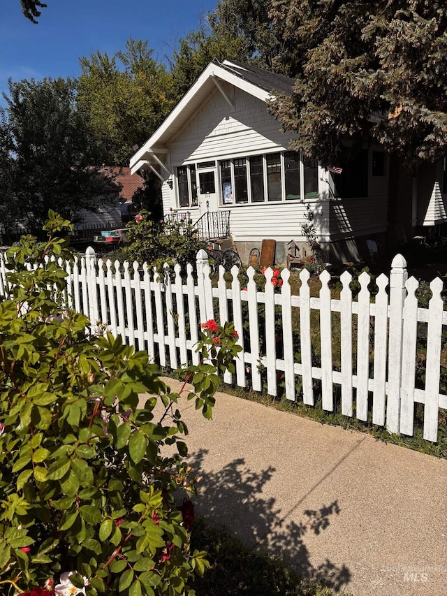 310 N 9th E, Mountain Home, ID 83647 - bungalow-style home featuring a fenced front yard