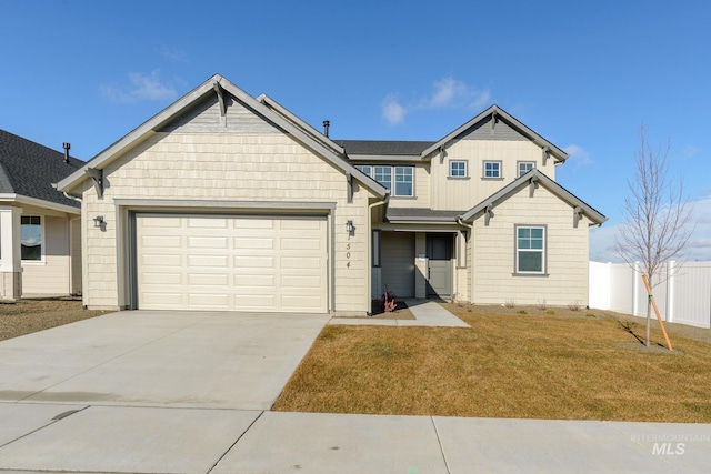 view of front facade featuring a garage and a front lawn