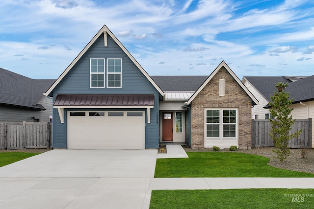 10305 Stony Oak Ct, Nampa, ID 83687 - view of front of house with concrete driveway, brick siding, a standing seam roof, and a metal roof
