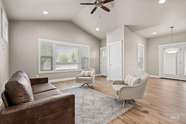 1457 Summerheights, Meridian, ID 83646 - living room featuring a ceiling fan, baseboards, lofted ceiling, light wood-style floors, and recessed lighting
