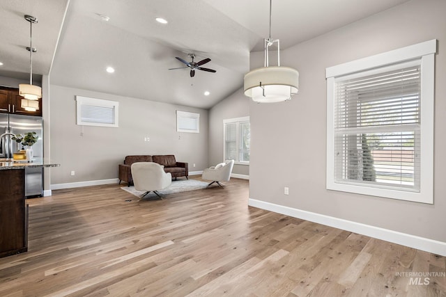 1457 Summerheights, Meridian, ID 83646 - sitting room with baseboards, a ceiling fan, light wood-style floors, and lofted ceiling