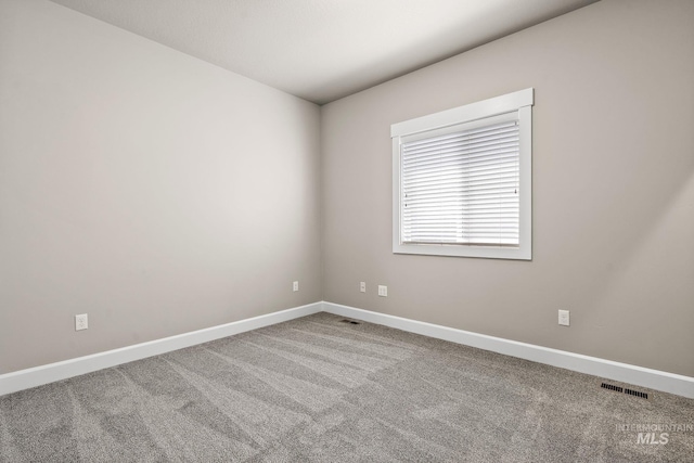 1457 Summerheights, Meridian, ID 83646 - spare room featuring baseboards, carpet, and visible vents