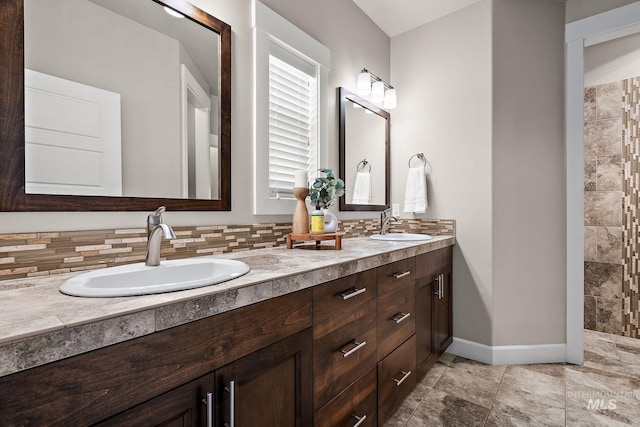 1457 Summerheights, Meridian, ID 83646 - bathroom with a sink, baseboards, decorative backsplash, and double vanity