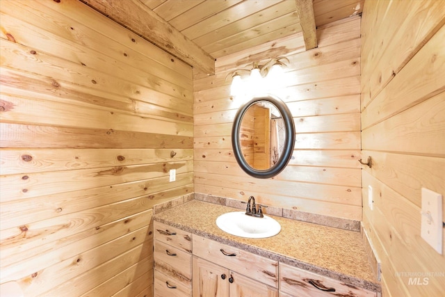56 Burden Rd, Salmon, ID 83467 - bathroom with wooden walls, wooden ceiling, vanity, and beam ceiling