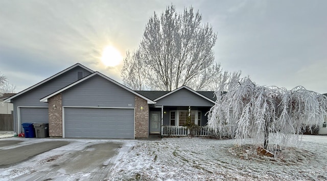 view of front of property featuring a garage and a porch