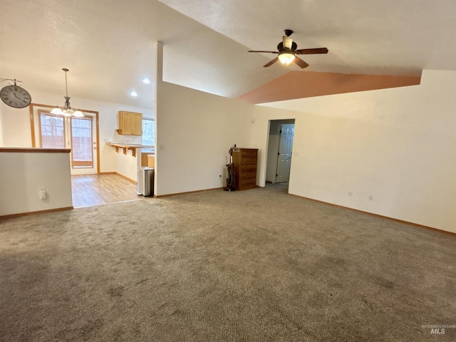 unfurnished living room featuring light carpet, lofted ceiling, and ceiling fan