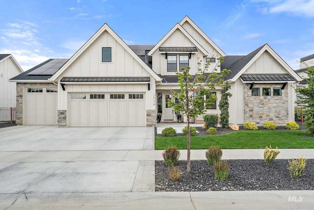 view of front of house with a garage and solar panels