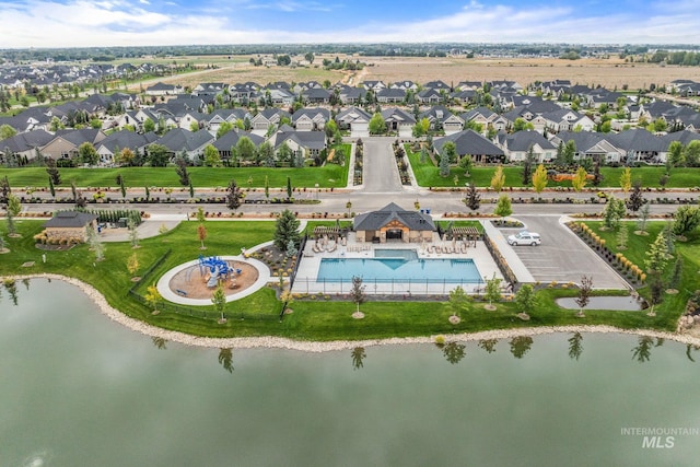 birds eye view of property featuring a water view