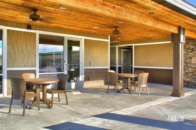 view of patio / terrace featuring outdoor dining space and a ceiling fan