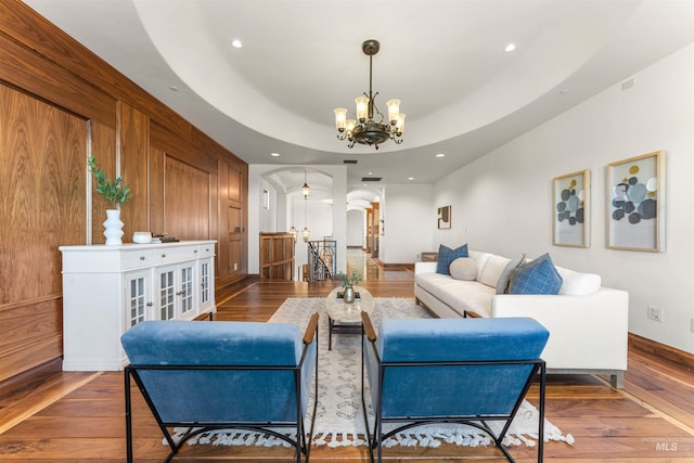 living room featuring hardwood / wood-style flooring and a notable chandelier