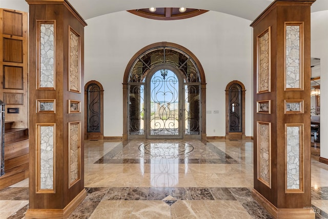 entryway featuring high vaulted ceiling