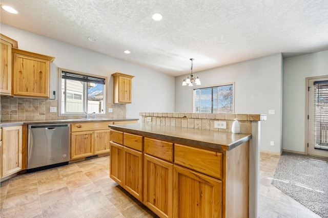 kitchen with a sink, hanging light fixtures, dishwasher, tasteful backsplash, and a chandelier