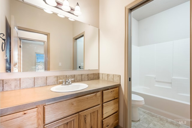 full bath with tile patterned floors, toilet, and vanity