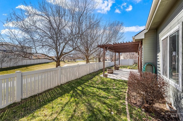 view of yard with a patio area, a pergola, and a fenced backyard