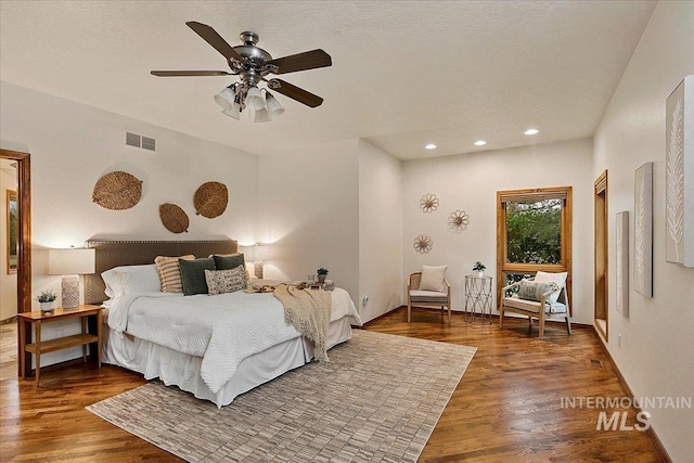 bedroom featuring dark hardwood / wood-style floors and ceiling fan